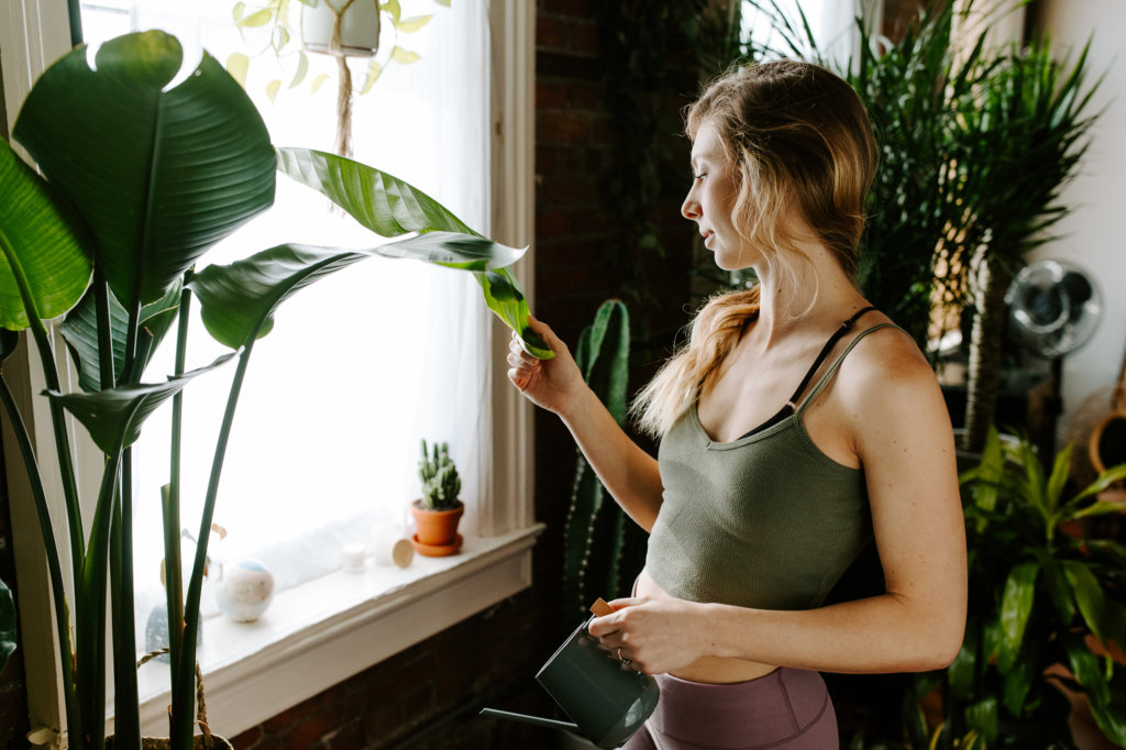 woman-looking-at-a-birds-of-paradise
